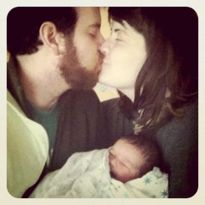 kiss newborn family